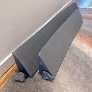 Two triangular wedge pillows in grey (sold separately, different sizes)